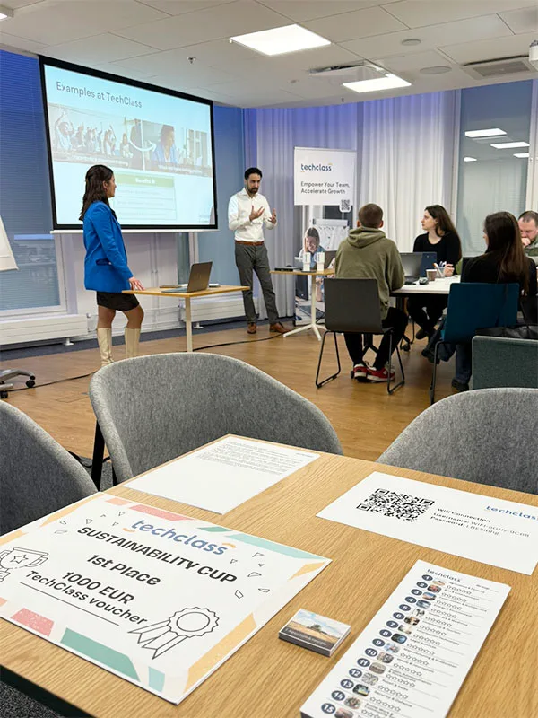 Trainers and participants working together at a TechClass workshop